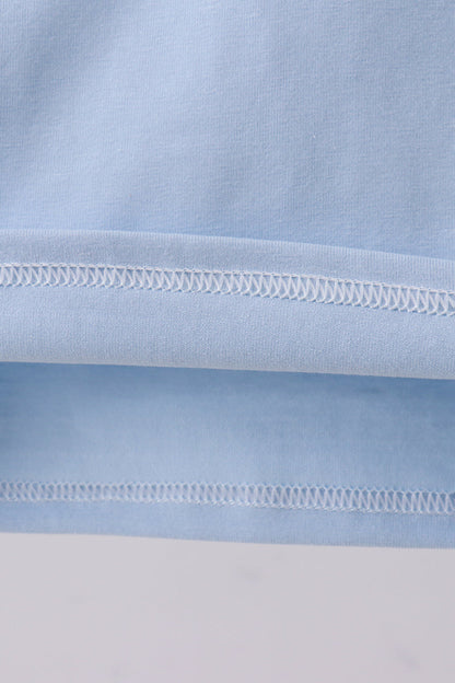 Blue construction embroidery top